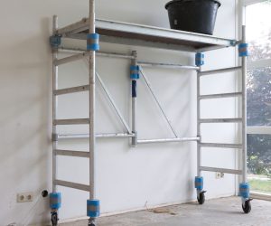 Worker tools - Bucket standing on rolling scaffolding (plaster work)